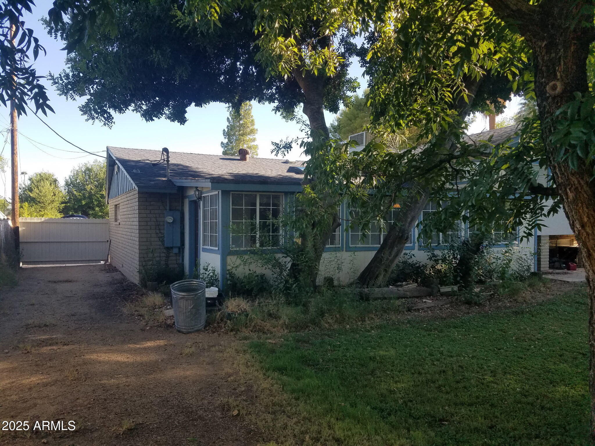 3214 West State Avenue Phoenix, AZ 85051 - Photo 3 of 35 a view of a house with a yard and tree s
