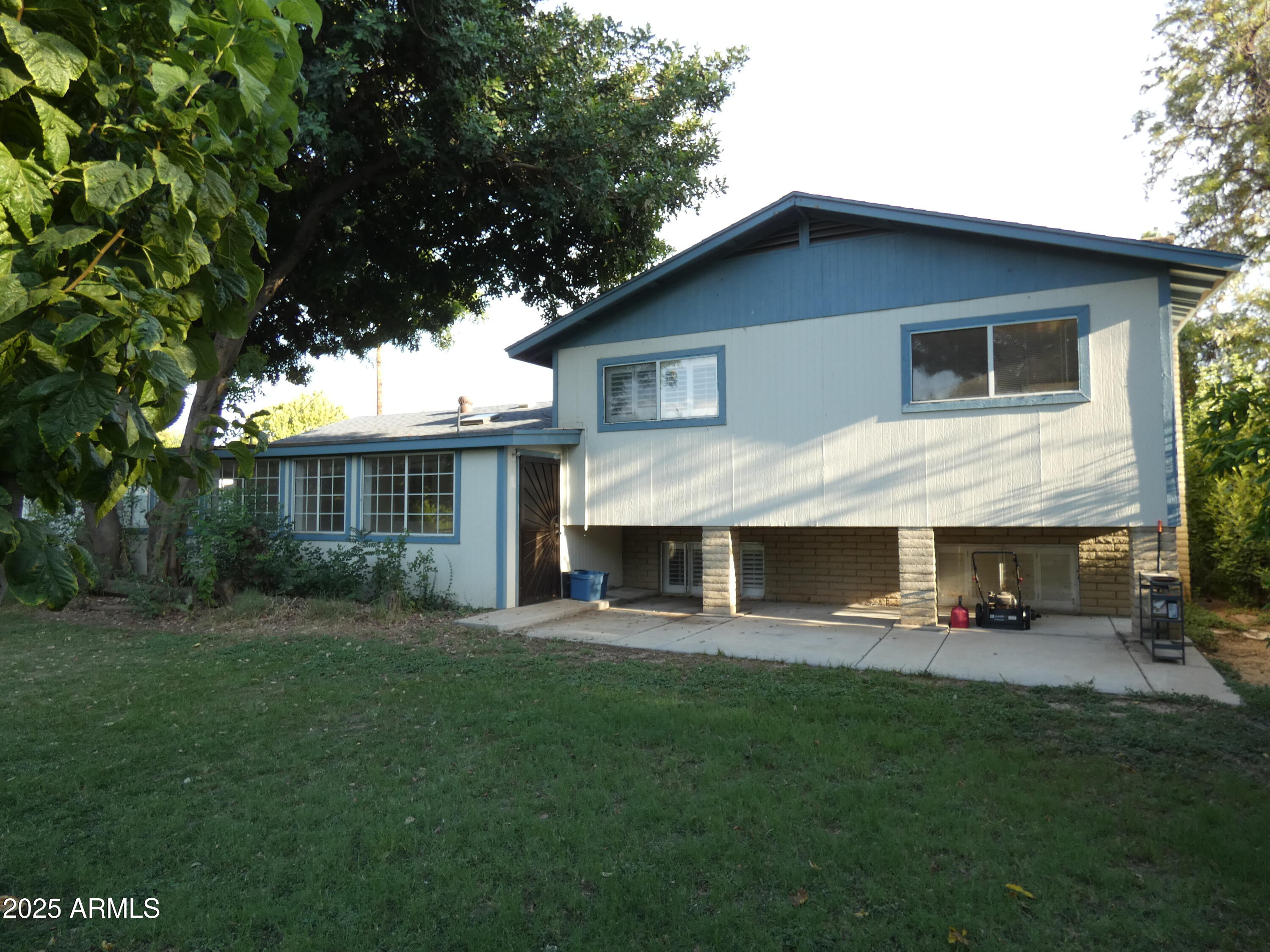 3214 West State Avenue Phoenix, AZ 85051 - Photo 31 of 35 a front view of a house with a yard table and chairs