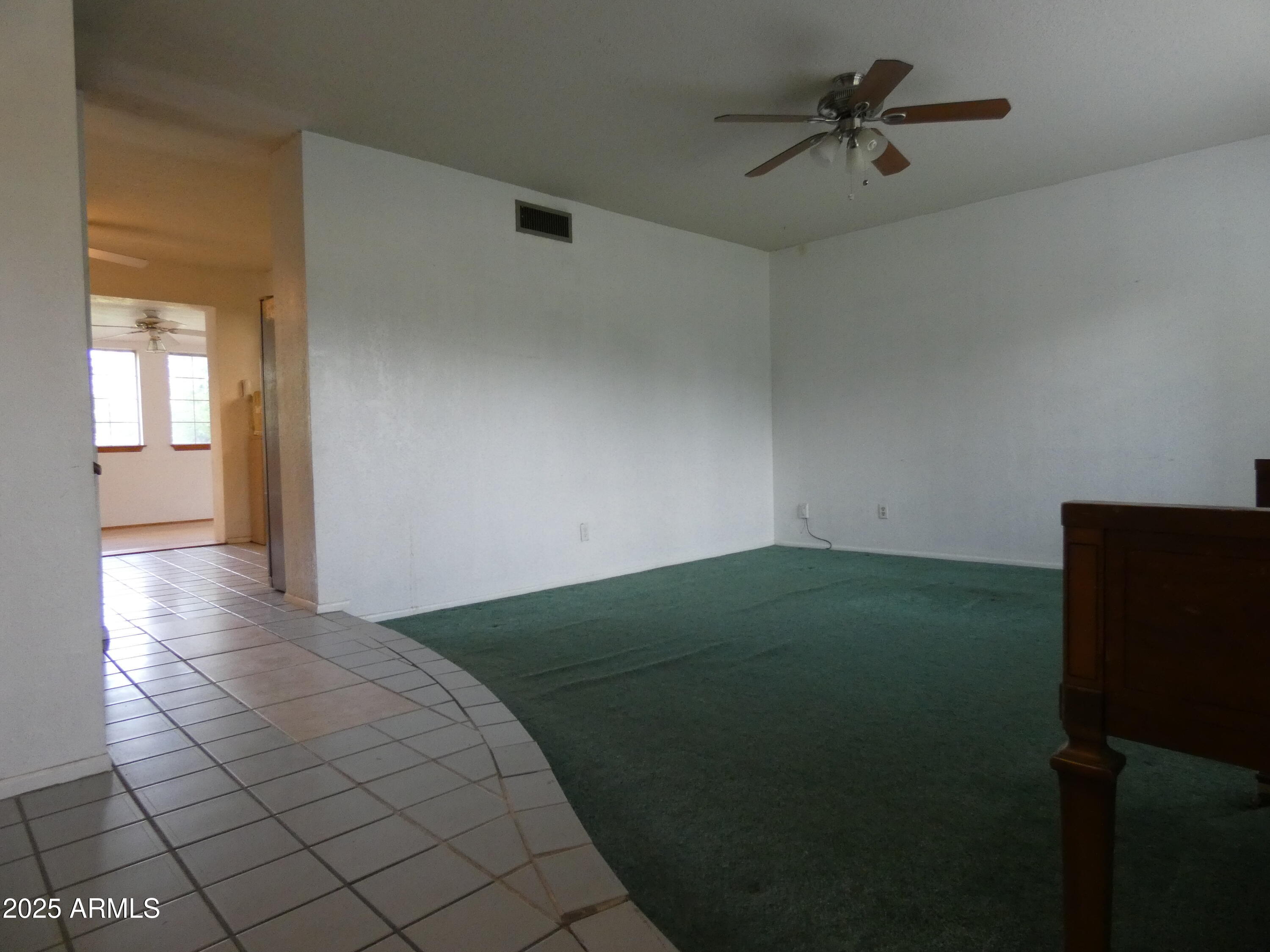 3214 West State Avenue Phoenix, AZ 85051 - Photo 7 of 35 a view of a big room with wooden floor and windows