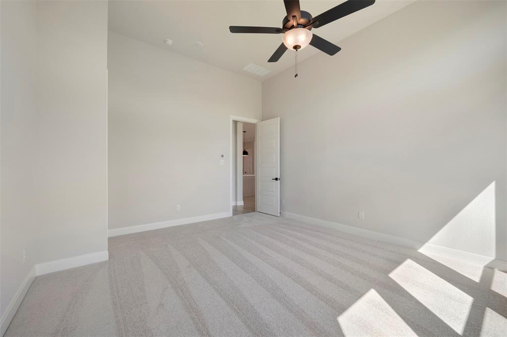 3575 Redbud Flower Trail Venus, TX 76084 - Photo 31 of 36 Unfurnished room featuring a high ceiling, light carpet, and a ceiling fan