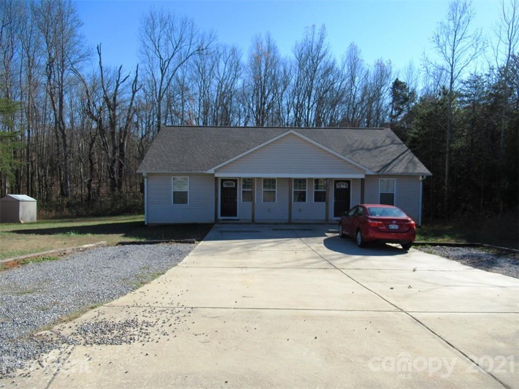 858 Horseshoe Lake Road Lincolnton, NC 28092 - Photo 1 of 16 a front view of a house with a yard and trees