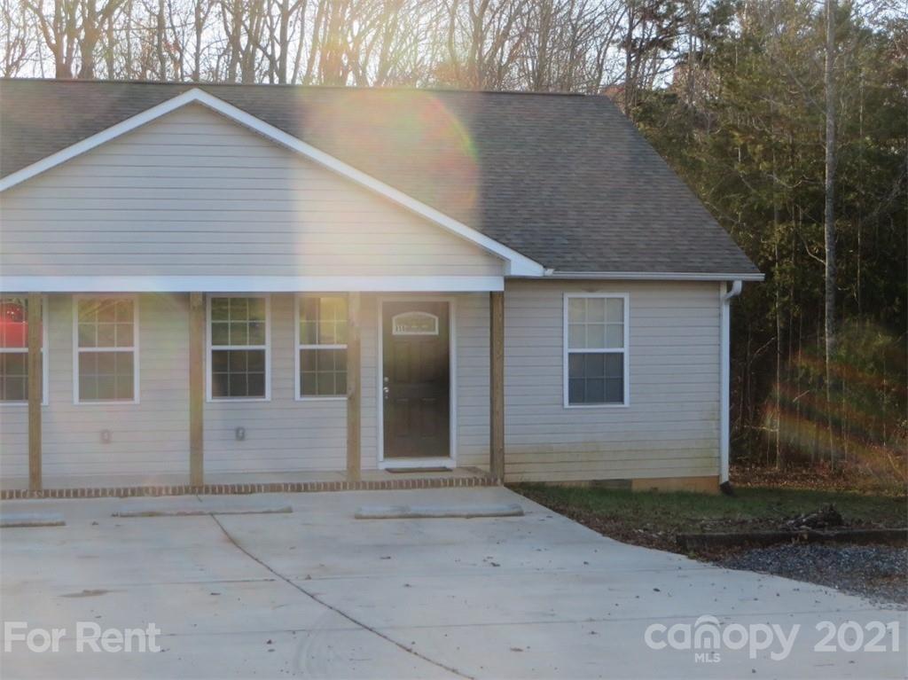 858 Horseshoe Lake Road Lincolnton, NC 28092 - Photo 2 of 16 a front view of a house with a yard and garage