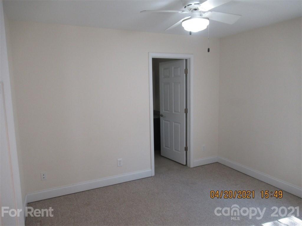 858 Horseshoe Lake Road Lincolnton, NC 28092 - Photo 13 of 16 an empty room with a chandelier fan
