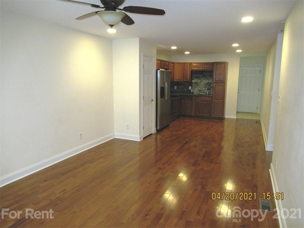 858 Horseshoe Lake Road Lincolnton, NC 28092 - Photo 3 of 16 a view of a livingroom with a ceiling fan & kitchen space
