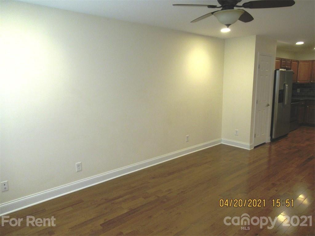 858 Horseshoe Lake Road Lincolnton, NC 28092 - Photo 5 of 16 an empty room with wooden floor and fan