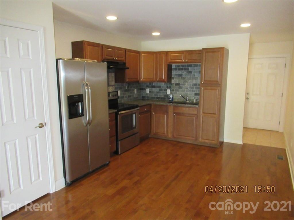 858 Horseshoe Lake Road Lincolnton, NC 28092 - Photo 9 of 16 a kitchen with stainless steel appliances granite countertop a refrigerator and a sink