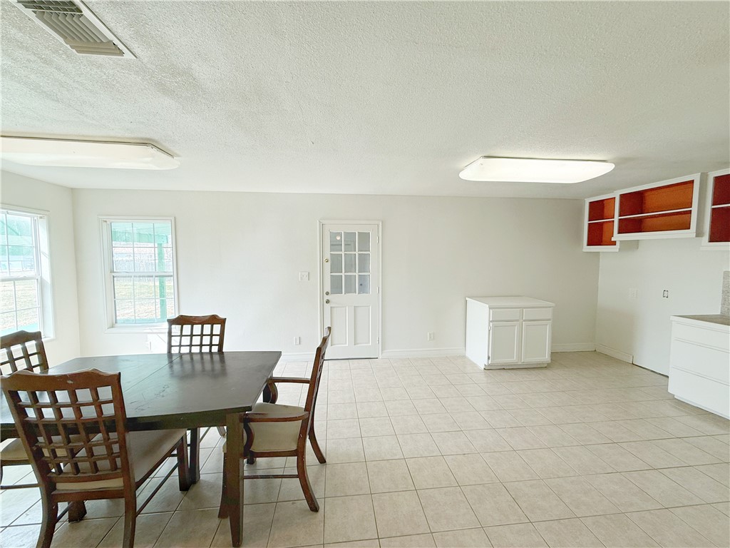 2325 1st Street Ingleside, TX 78362 - Photo 16 of 31 a view of a dining room with furniture and wooden floor