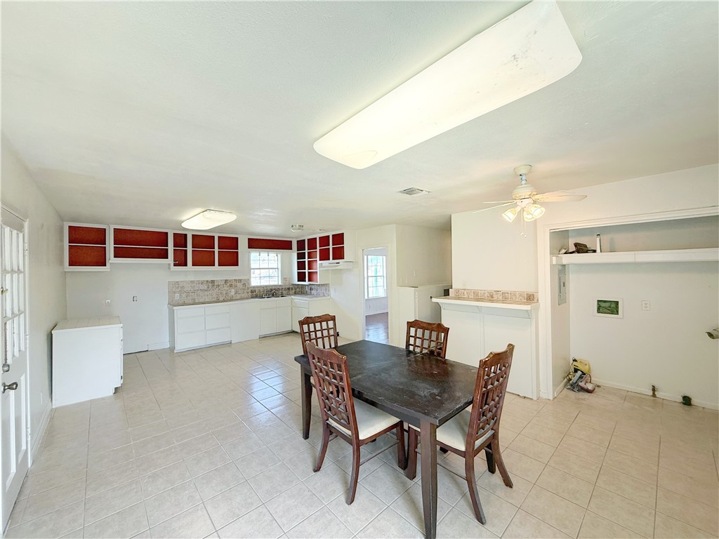 2325 1st Street Ingleside, TX 78362 - Photo 19 of 31 a view of a dining room with furniture and wooden floor