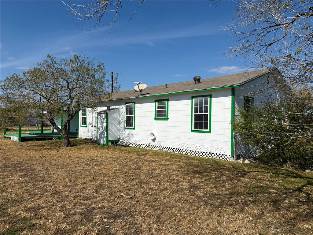 2325 1st Street Ingleside, TX 78362 - Photo 2 of 31 a house with trees in front of it