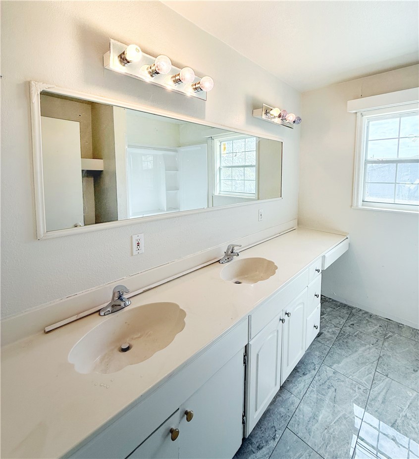 2325 1st Street Ingleside, TX 78362 - Photo 24 of 31 a bathroom with a double vanity sink mirror and
