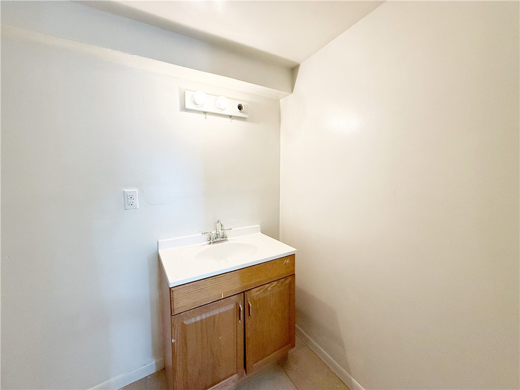 2325 1st Street Ingleside, TX 78362 - Photo 25 of 31 a utility room with a sink a vanity and mirror