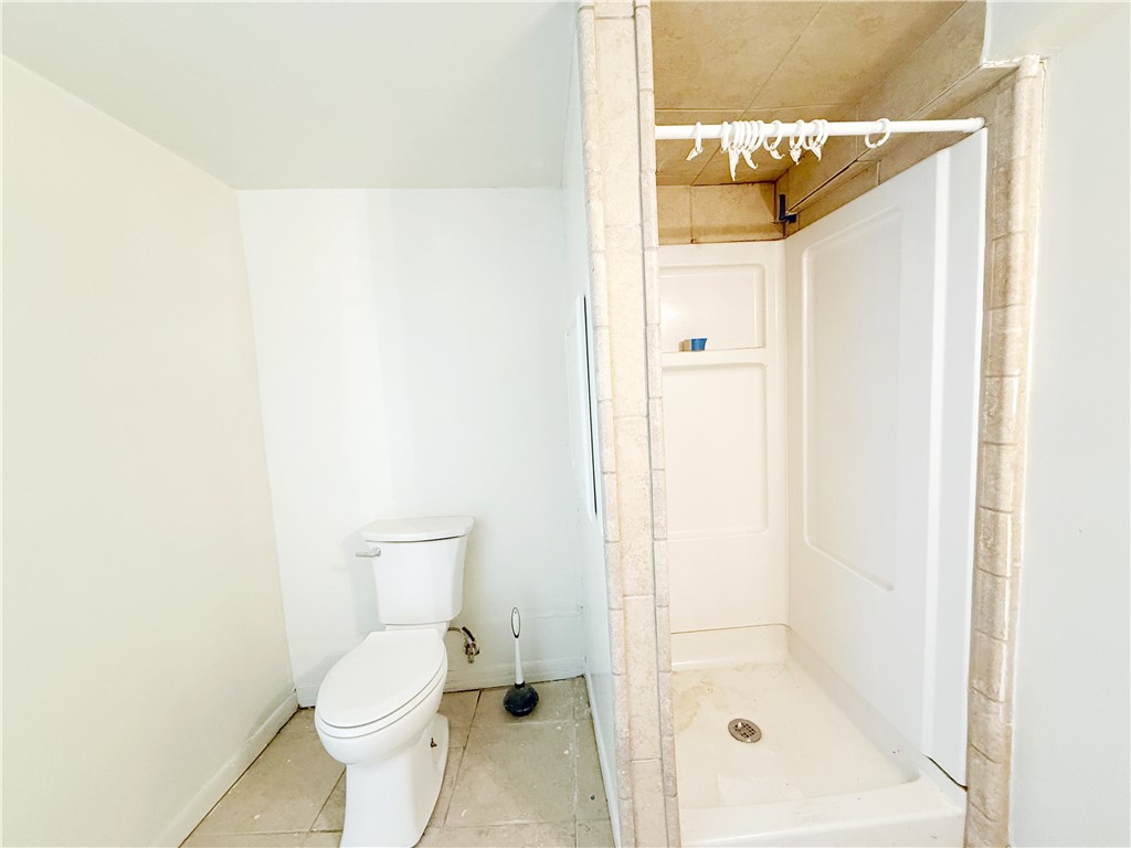 2325 1st Street Ingleside, TX 78362 - Photo 26 of 31 a bathroom with a toilet and a shower