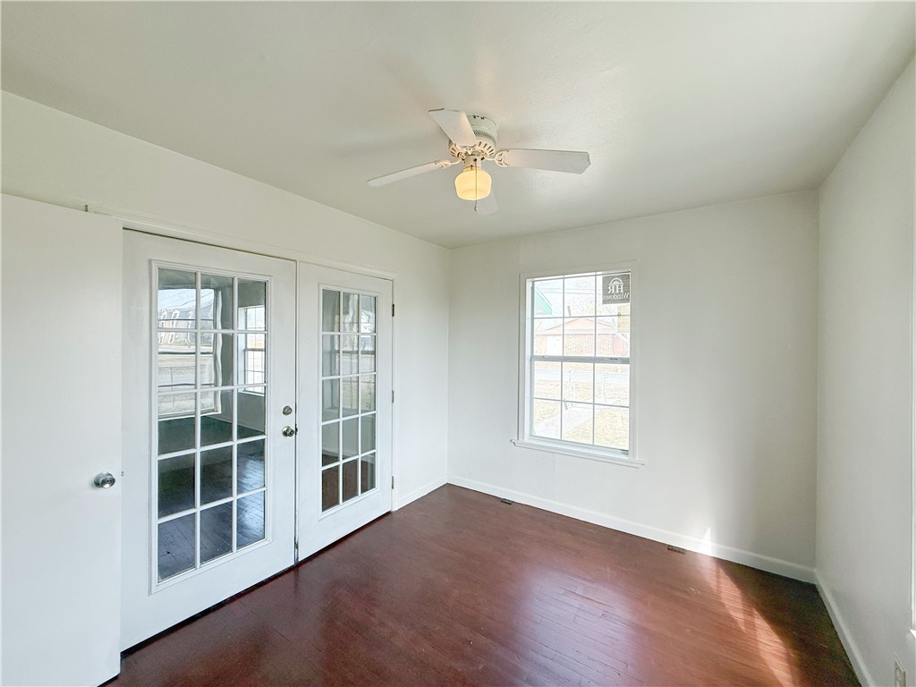 2325 1st Street Ingleside, TX 78362 - Photo 4 of 31 a view of an empty room with a window and wooden floor