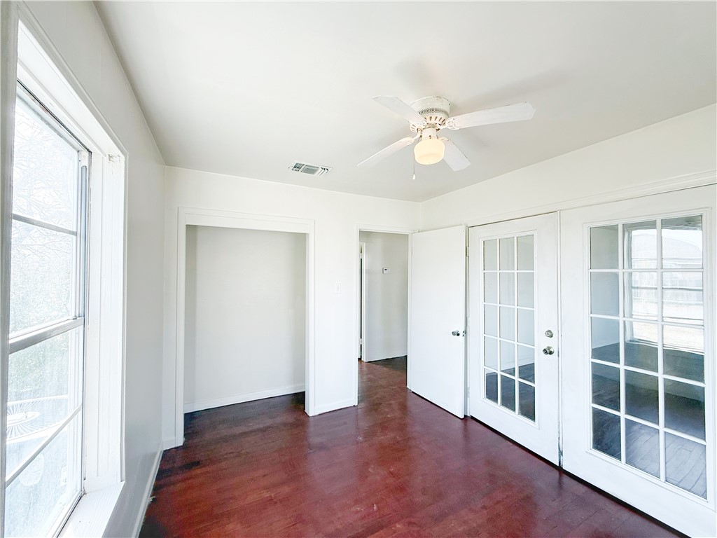 2325 1st Street Ingleside, TX 78362 - Photo 5 of 31 wooden floor in an empty room with a window