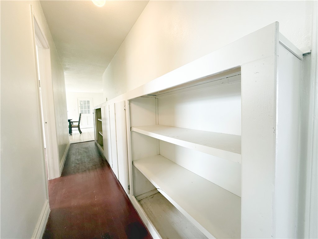 2325 1st Street Ingleside, TX 78362 - Photo 9 of 31 a view of a hallway with wooden shelves