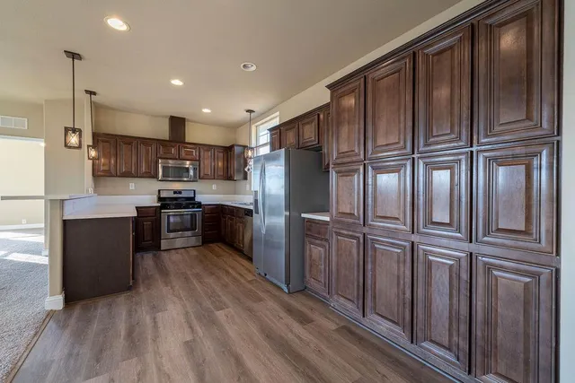 a view of a livingroom with a ceiling fan and window