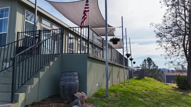 a view of a balcony with a floor to ceiling window and wooden floor