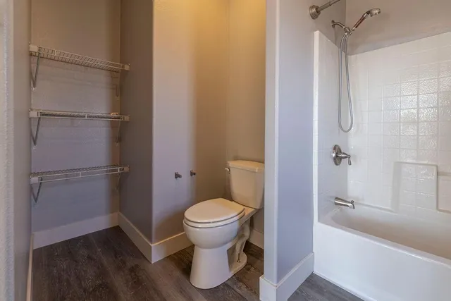 a stove top oven sitting inside of a kitchen