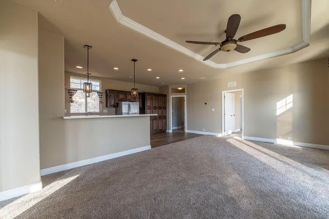 a kitchen with stainless steel appliances a stove a sink and a microwave