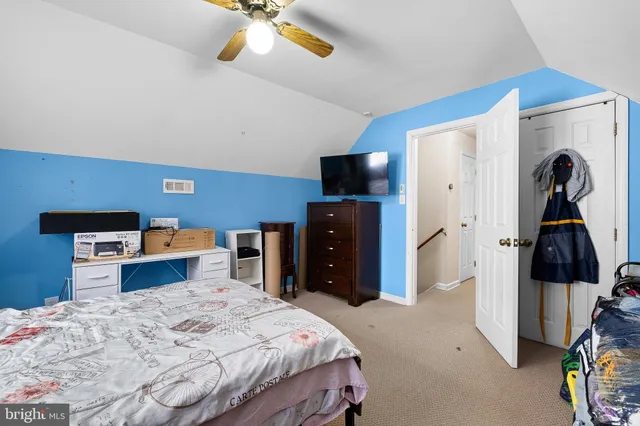 a bedroom with a bed and a walk in closet