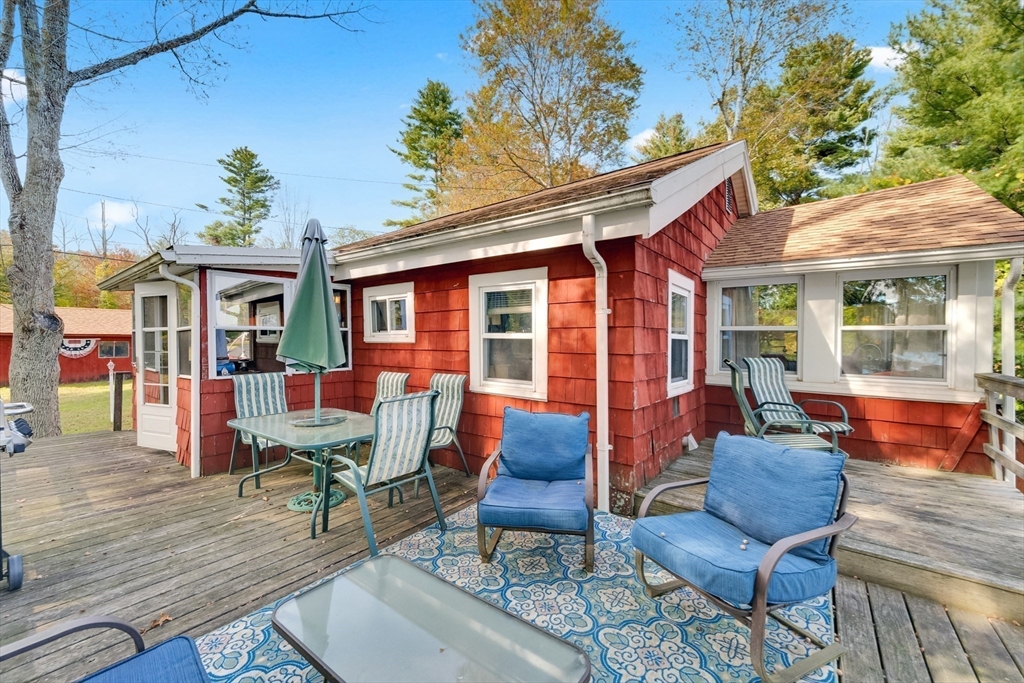 79 7th Street Brimfield, MA 01010 - Photo 11 of 32 a outdoor living area with furniture and a potted plant
