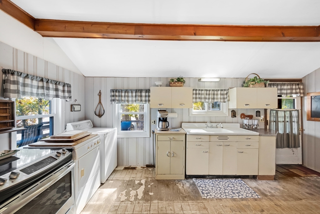 79 7th Street Brimfield, MA 01010 - Photo 15 of 32 a kitchen with a stove and cabinets