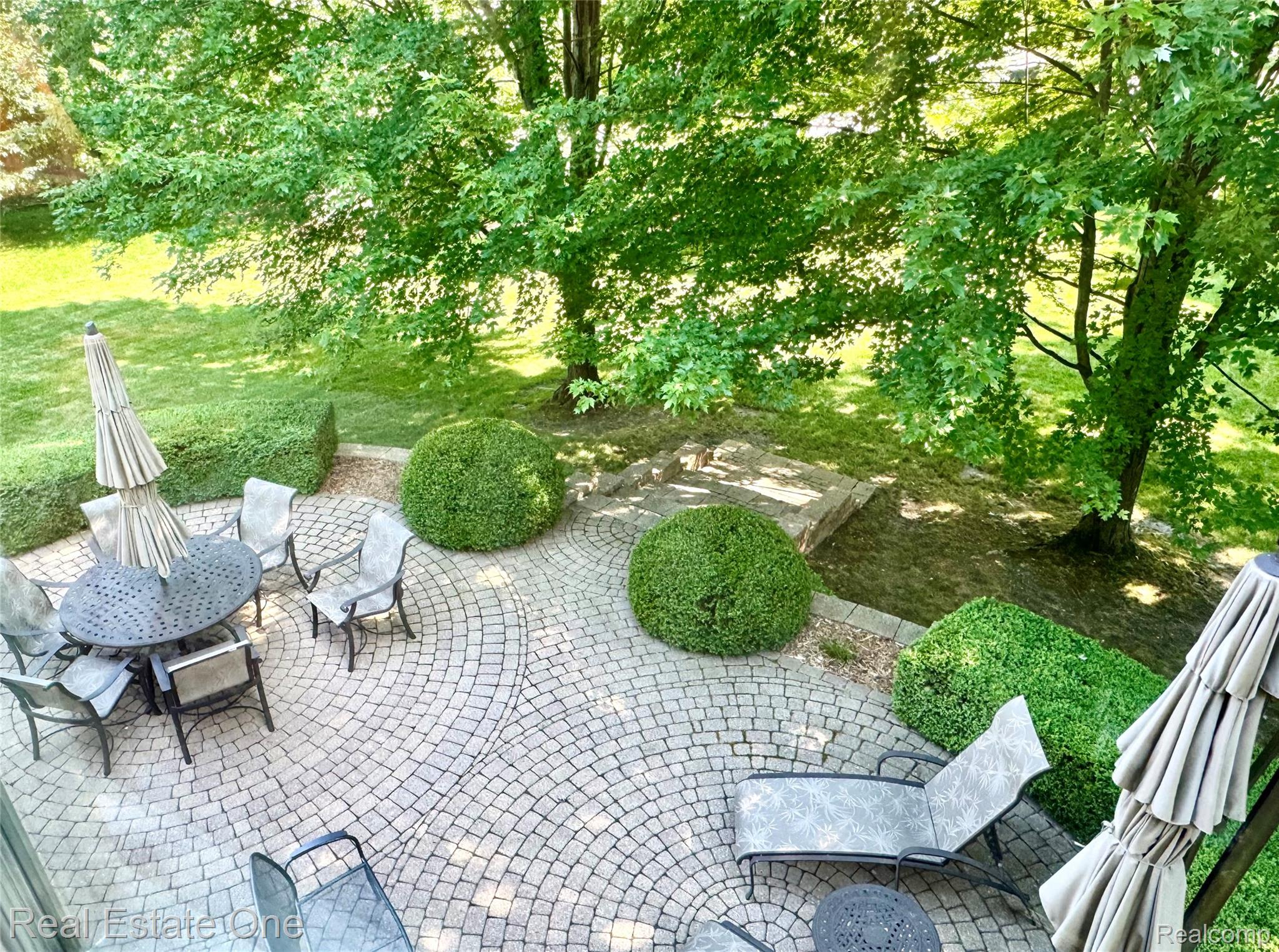 Expansive paver patio featuring a circular pattern