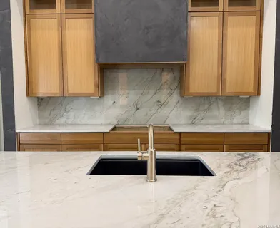 a kitchen with a sink and a window