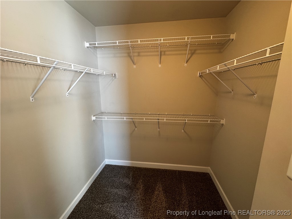 1328 St Johns Loop Raeford, NC 28376 - Photo 17 of 27 a view of a room with racks on the wall