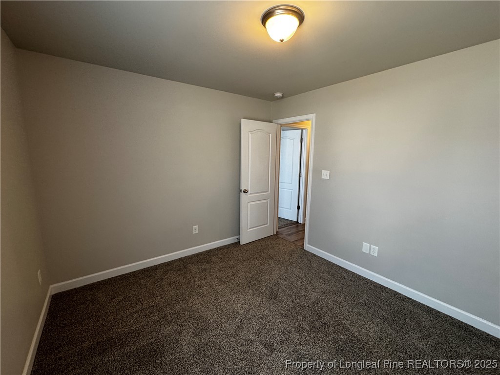1328 St Johns Loop Raeford, NC 28376 - Photo 19 of 27 an empty room with an entryway