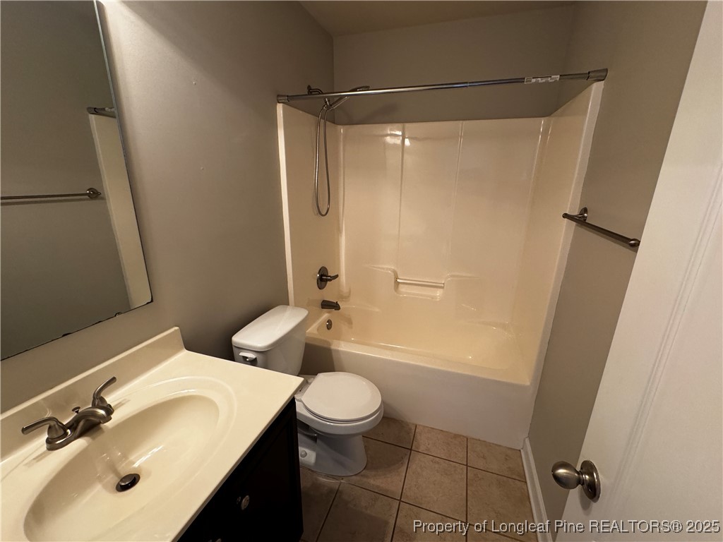 1328 St Johns Loop Raeford, NC 28376 - Photo 20 of 27 a bathroom with a sink a toilet and shower