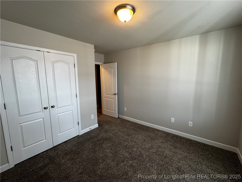 1328 St Johns Loop Raeford, NC 28376 - Photo 22 of 27 an empty room with closet area