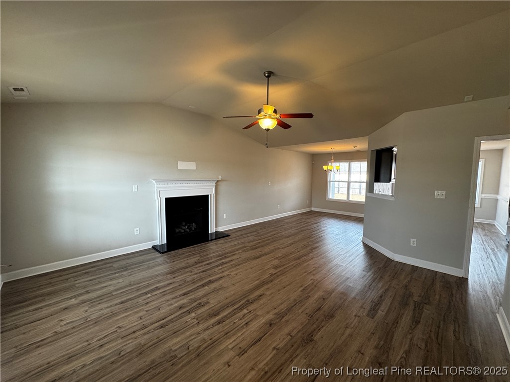 1328 St Johns Loop Raeford, NC 28376 - Photo 5 of 27 a view of empty room with wooden floor and fan