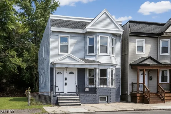 a front view of a house with a porch