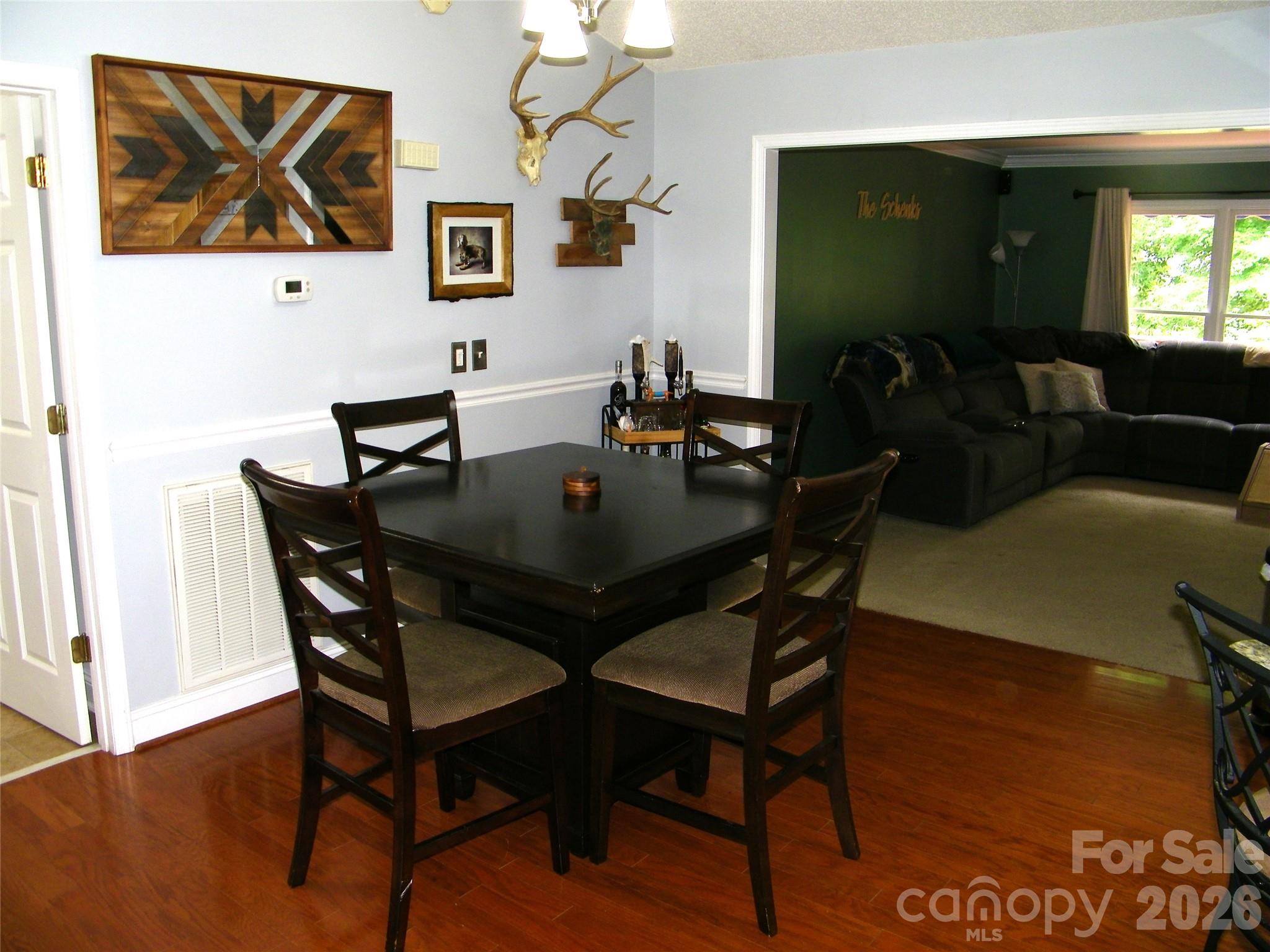 609 Redah Avenue Locust, NC 28097 - Photo 4 of 37 a view of a dining room with furniture and wooden floor