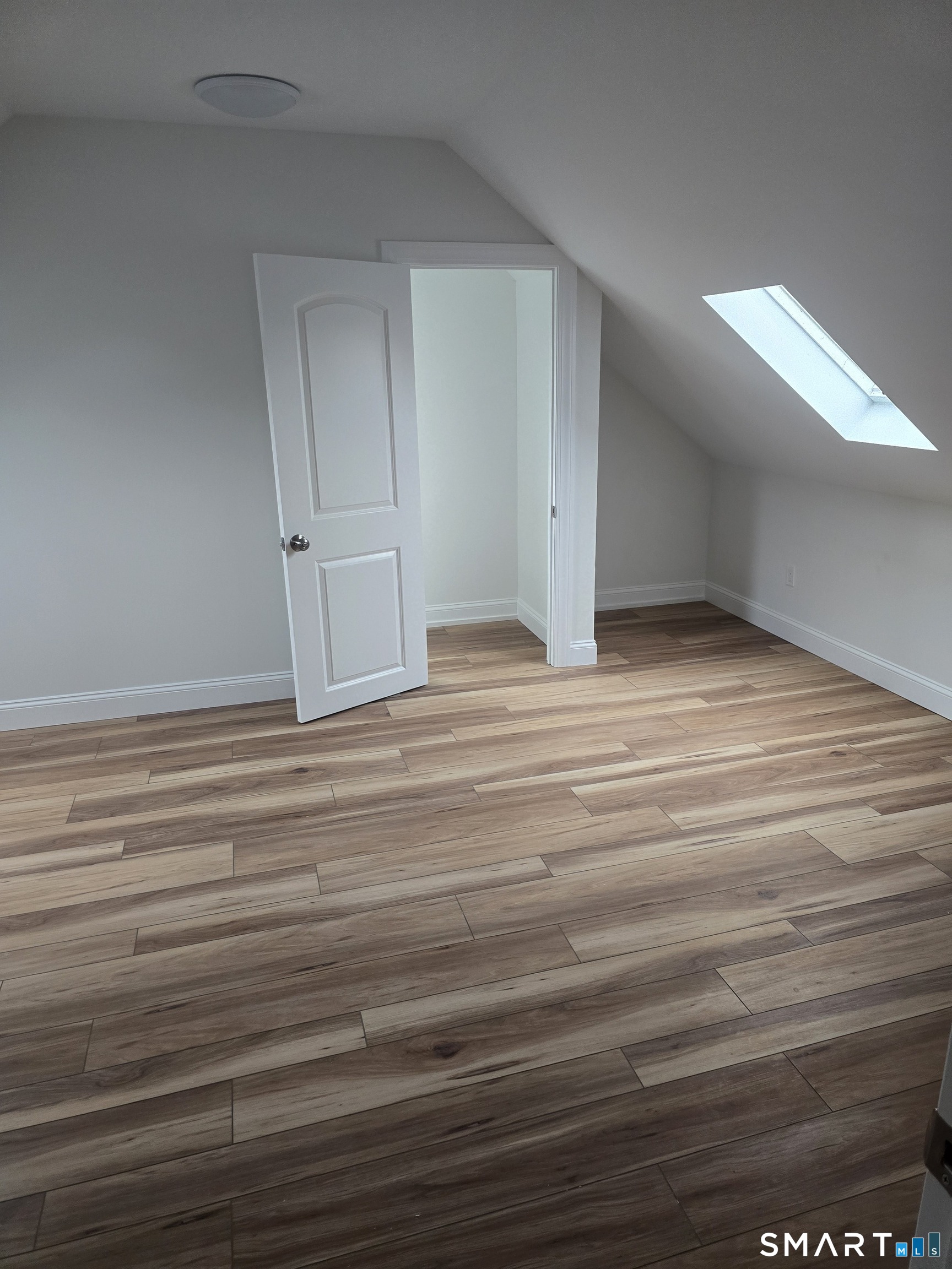 530 Jane Street, Unit 3 Bridgeport, CT 06608 - Photo 5 of 9 a view of empty room with wooden floor
