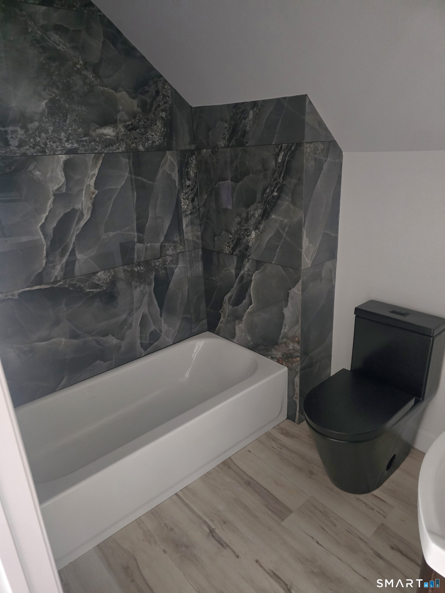 530 Jane Street, Unit 3 Bridgeport, CT 06608 - Photo 6 of 9 a bathroom with a bathtub and a toilet