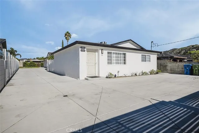 a view of a backyard of the house