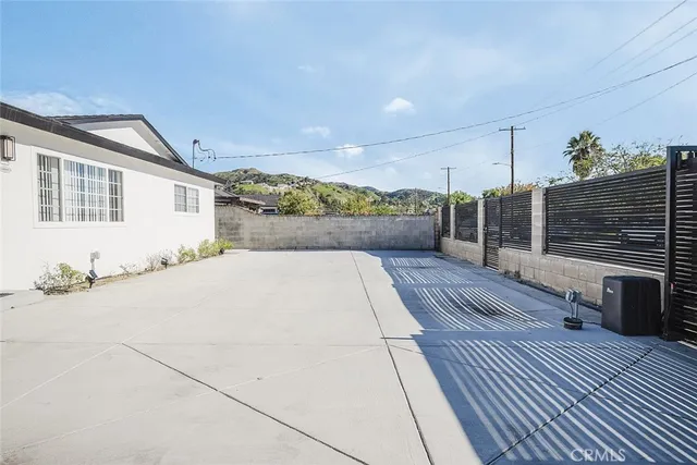 a view of kitchen with sink and wooden floor