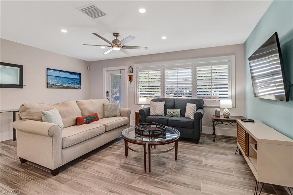 3470 Lakeview Drive Naples, FL 34112 - Photo 5 of 16 a living room with furniture and a large window