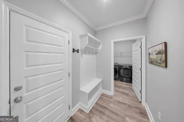 a bathroom with a tub and a shower