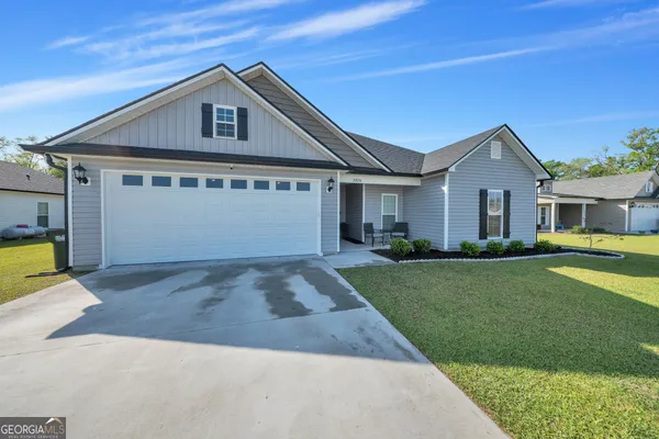 a front view of a house with a yard