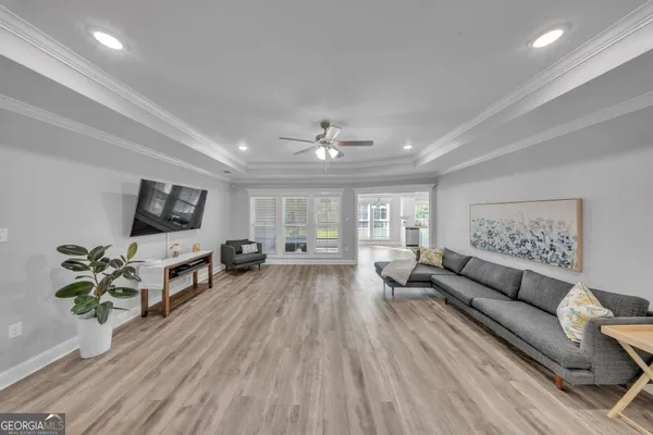 a living room with furniture and a flat screen tv