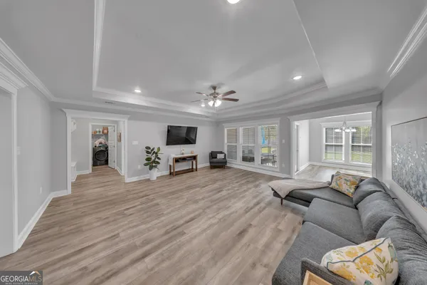 a living room with furniture and a flat screen tv