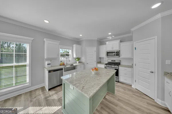 a kitchen with a stove and a refrigerator