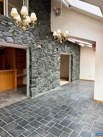 a kitchen with stainless steel appliances granite countertop a sink and a stove
