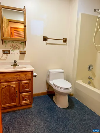 a bathroom with a granite countertop sink a mirror and a vanity