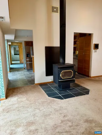 a view of a chandelier fan and a refrigerator in a room