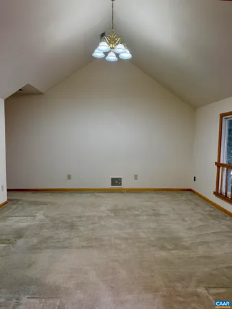a view of room with furniture and a ceiling fan