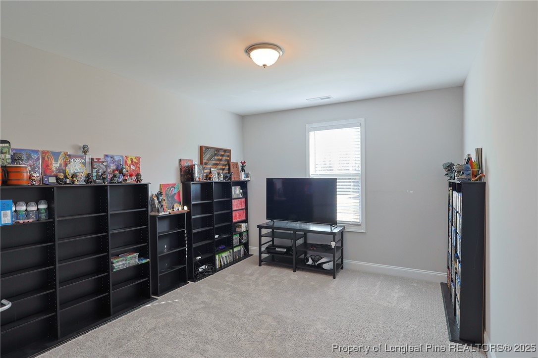 7810 Rufus Johnson Road St. Pauls, NC 28384 - Photo 16 of 24 a view of a workspace with furniture